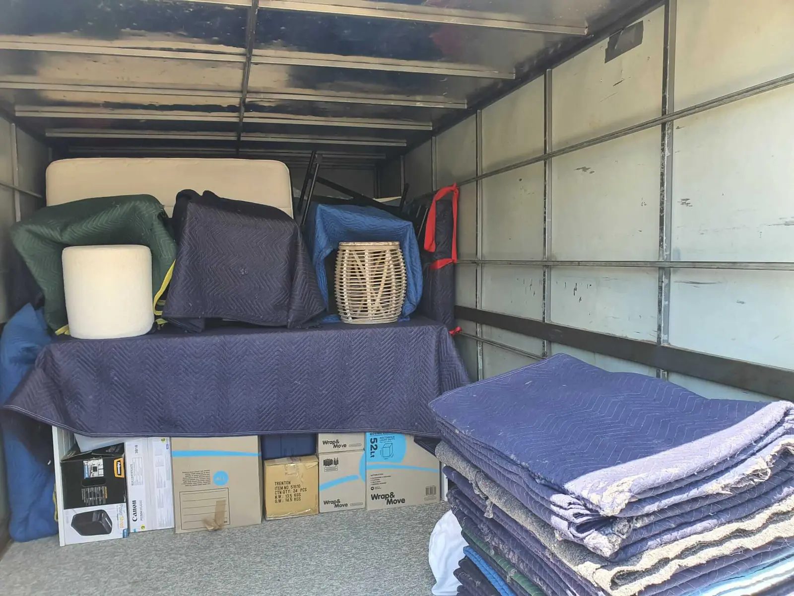 Furniture and boxes packed securely for a move